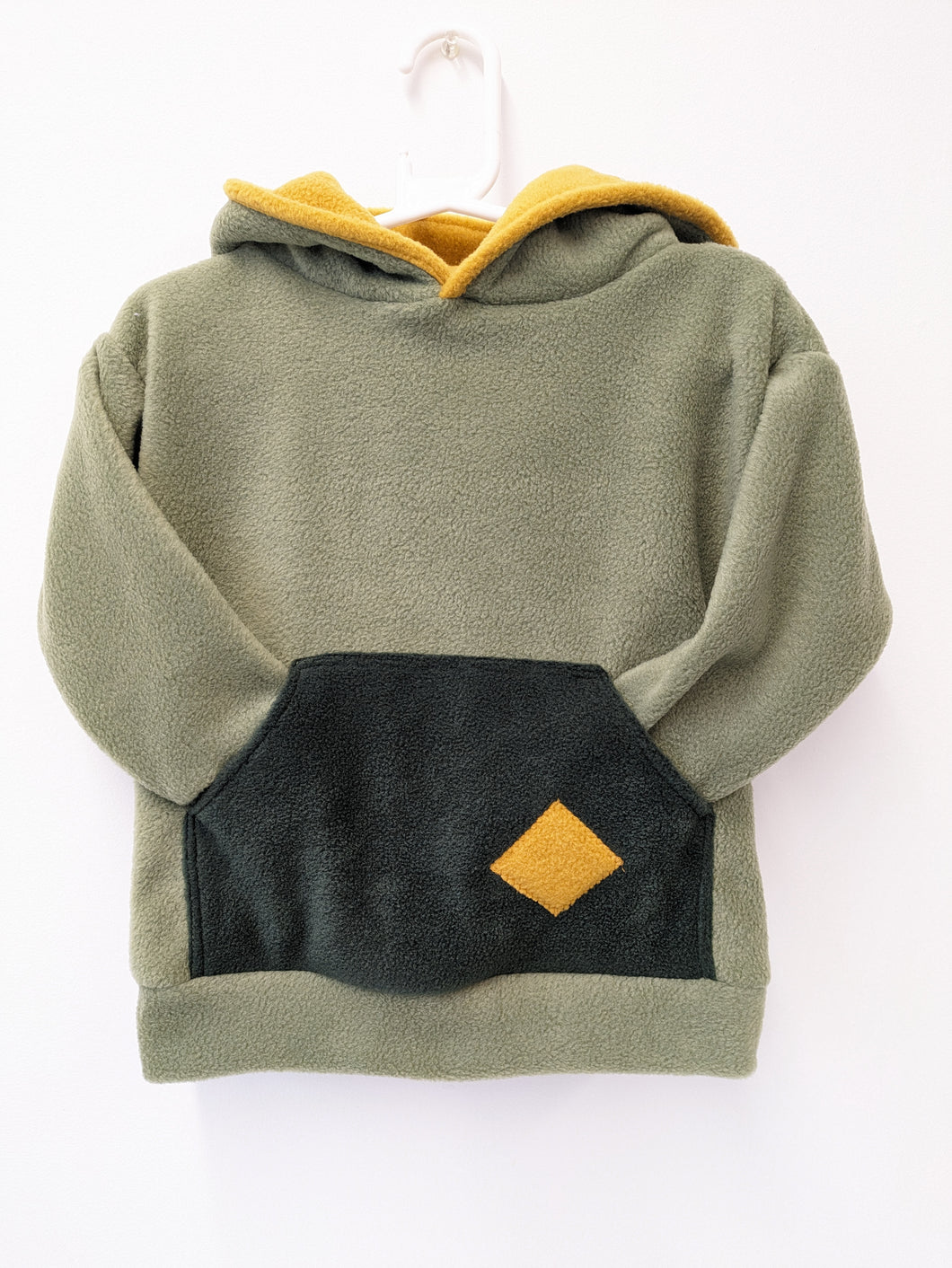 Kids green hoodie with pocket.
